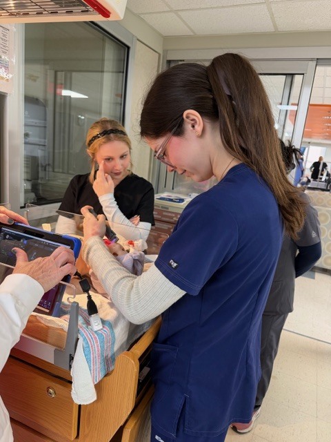 Allied health student participating in a simulation