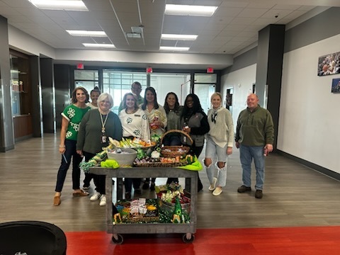 Admin with math and business teachers and the Whoop Whoop Wagon