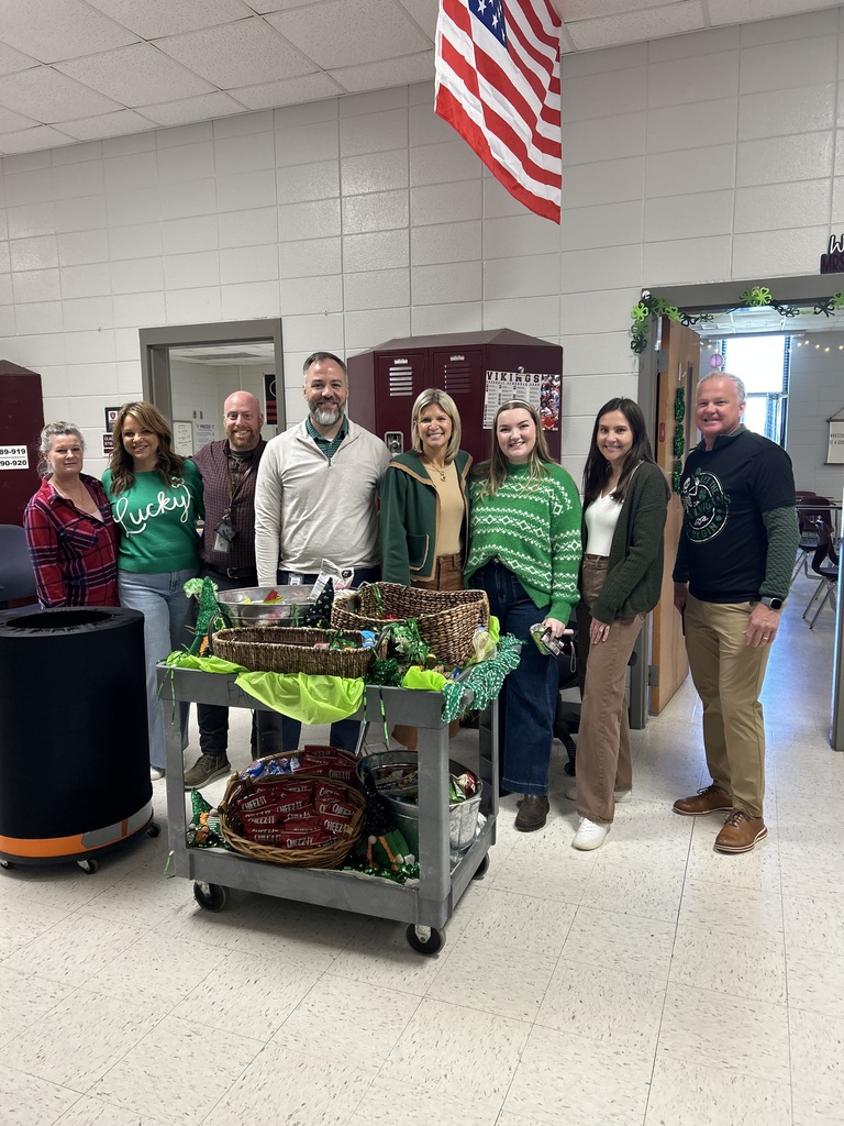 Admin with social studies teachers and the Whoop Whoop Wagon