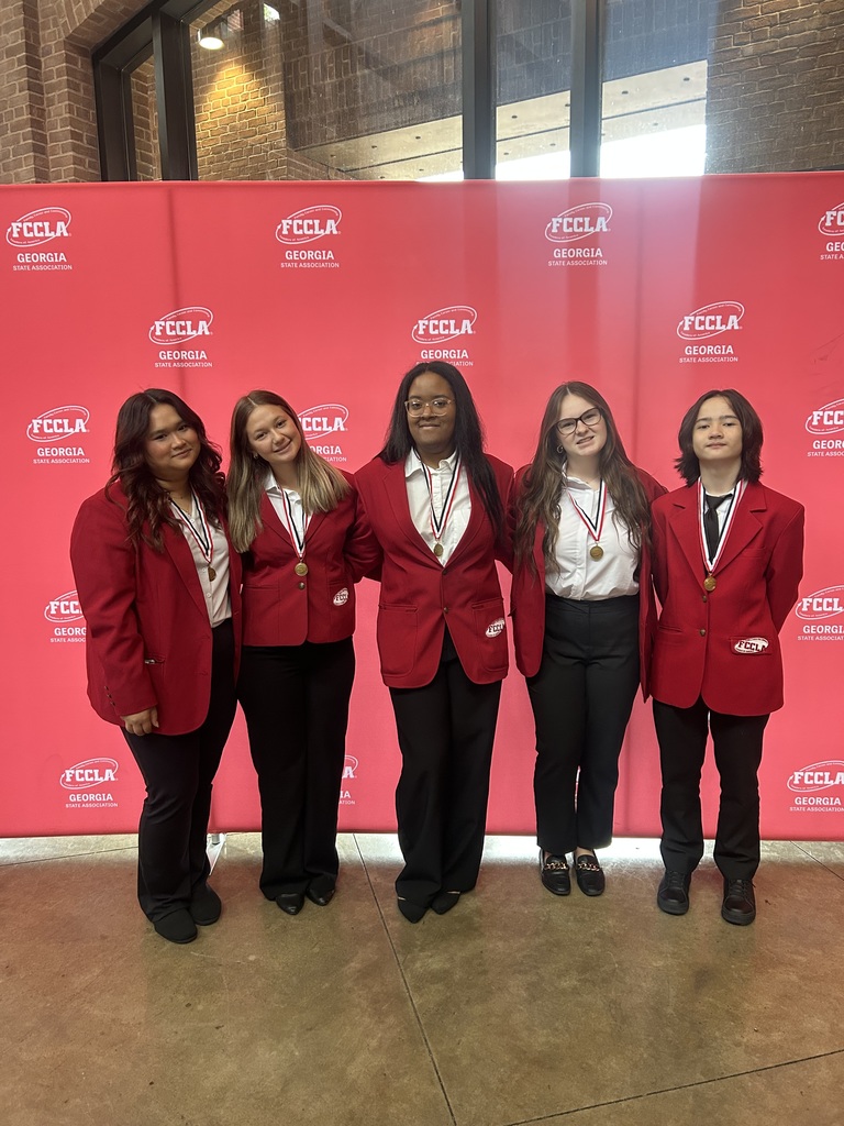 Five FCCLA members in their red blazers and pants