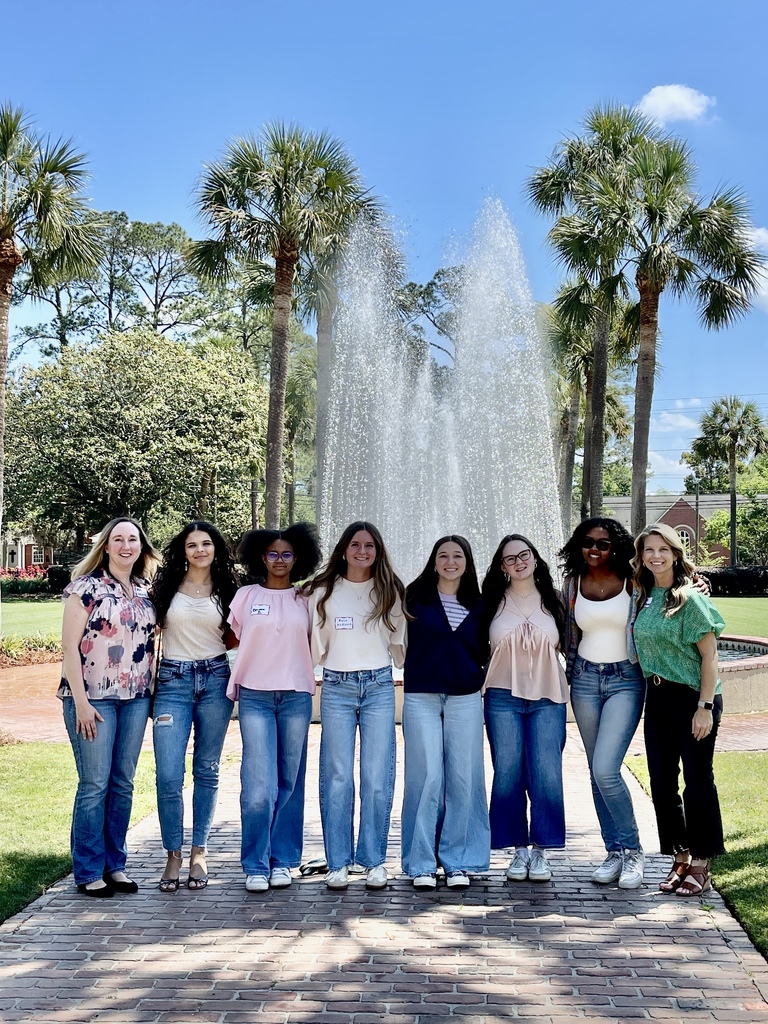 The students and math teachers in front of the fountain at VSU