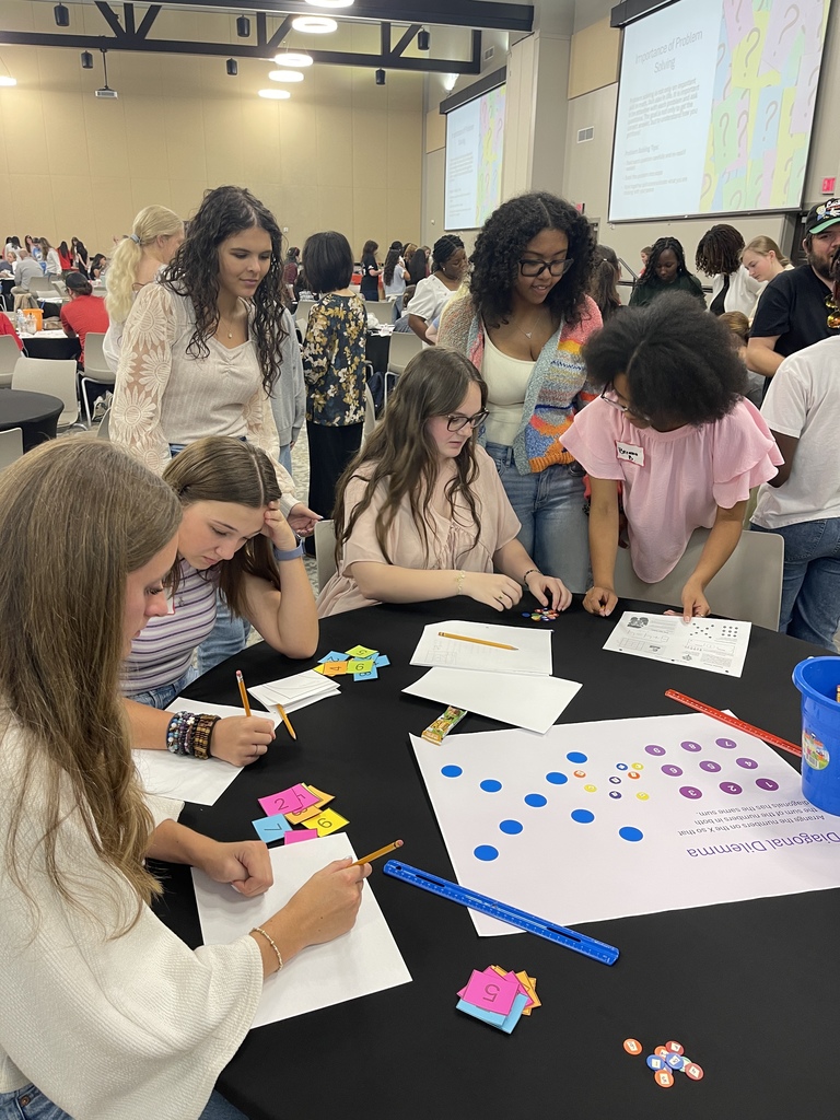 Six LHS Math students working on math problems