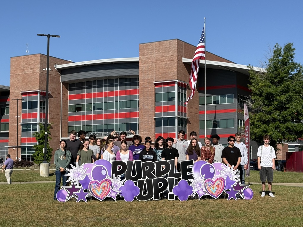 Military connected students at the Purple Up sign