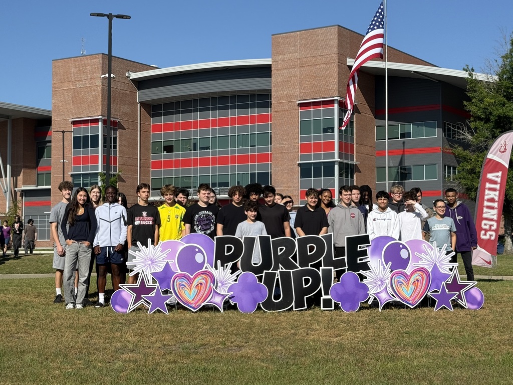 Military connected students at the Purple Up sign