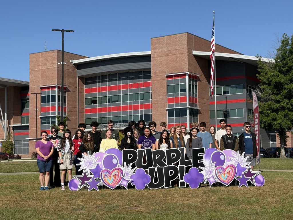 Military connected students at the Purple Up sign