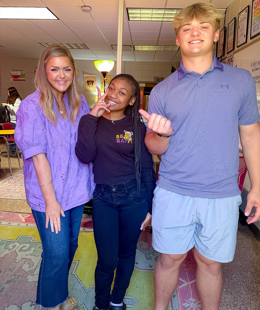 Teacher and students in purple