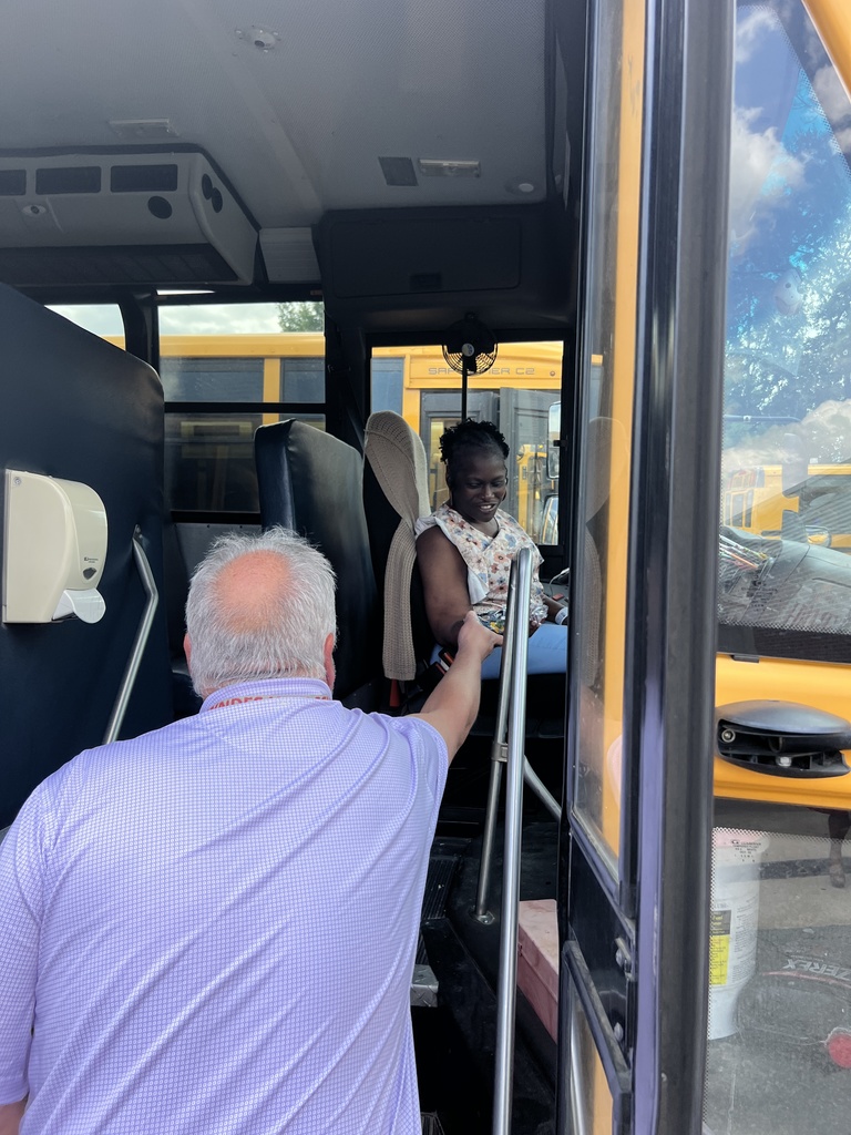 Teacher gifting a bus driver.