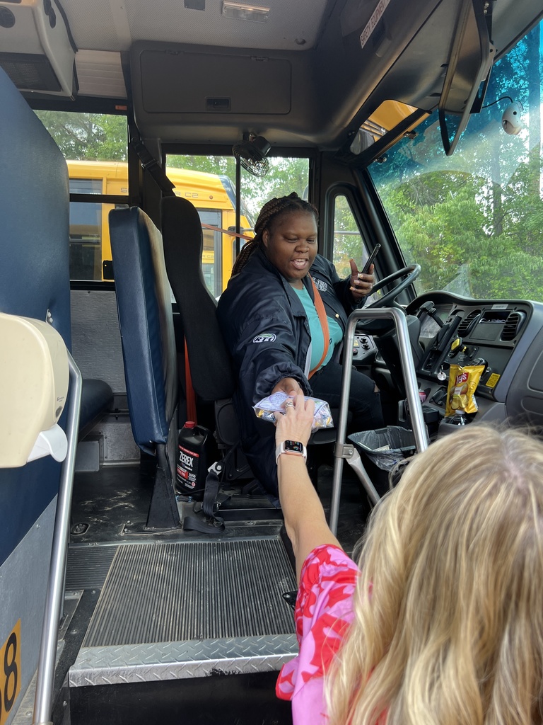 Bus driver receiving a gift.