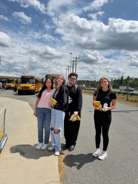 Students with chips and water for the bus drivers