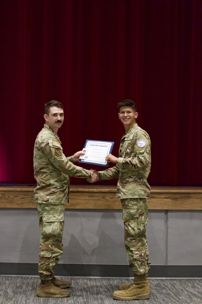 Cadet Colonel Matthew Youmans reciving a certificate.