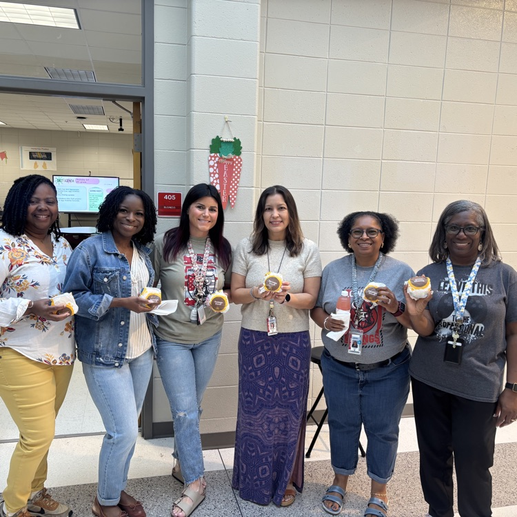 teachers holding biscuits