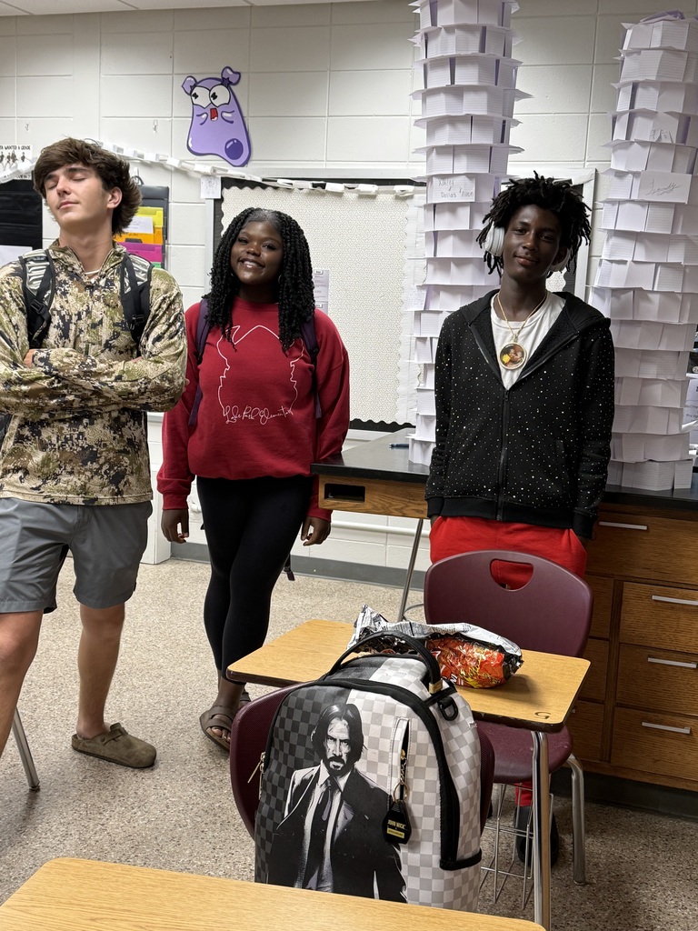 Students with paper towers