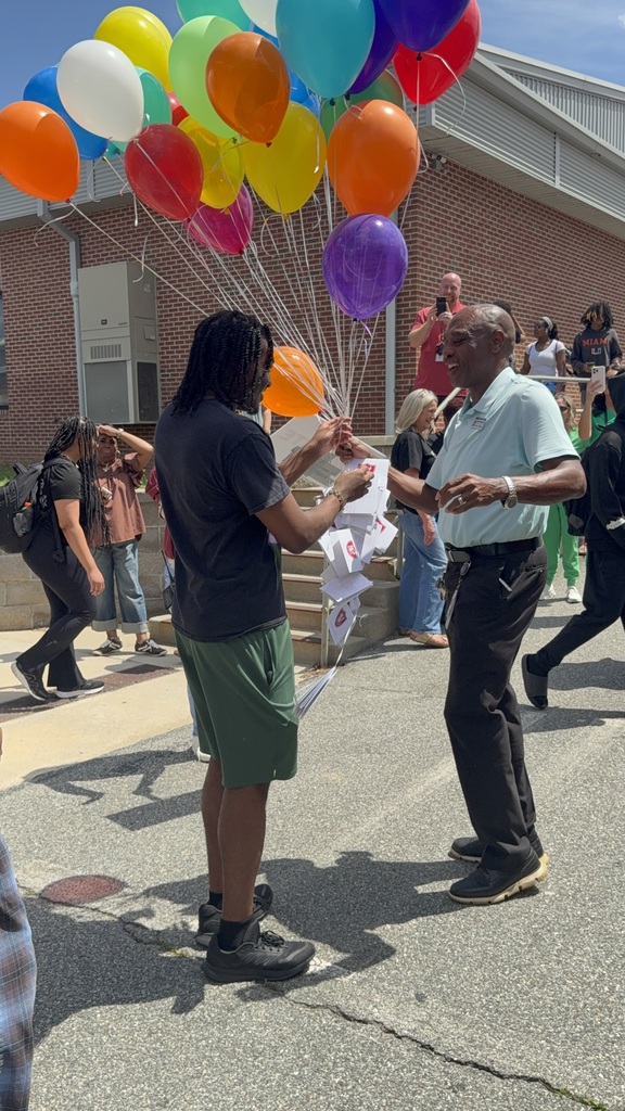 Mr. Walker's son handing him a balloon