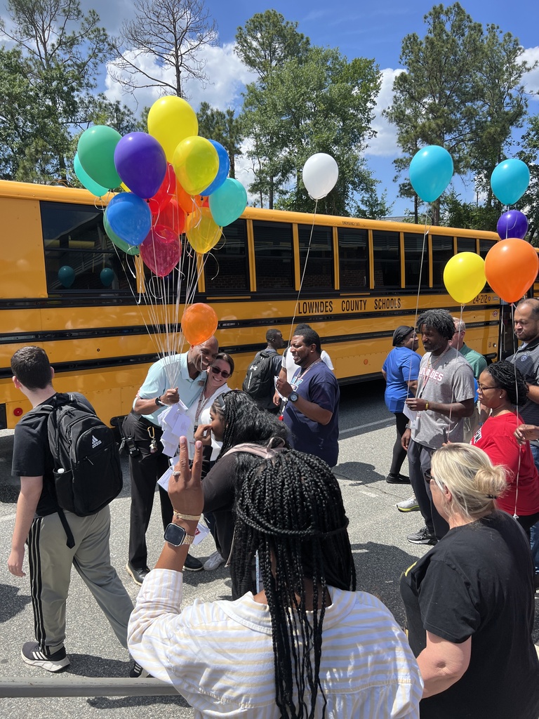 Mr. Walker receiving balloons from CTAE teachers