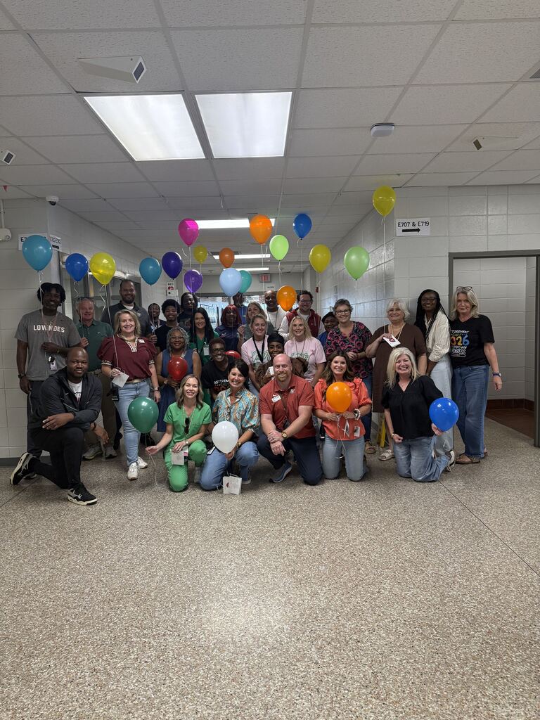 Staff waiting to surprise Mr. Walker 