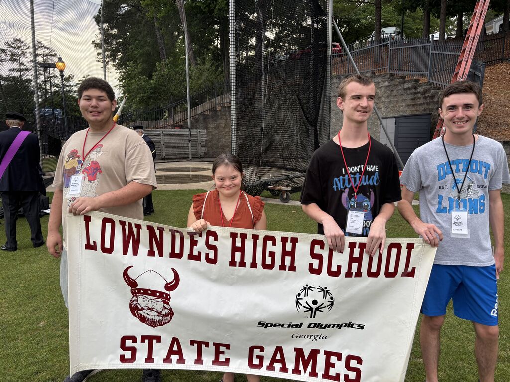 Athletes with school banner