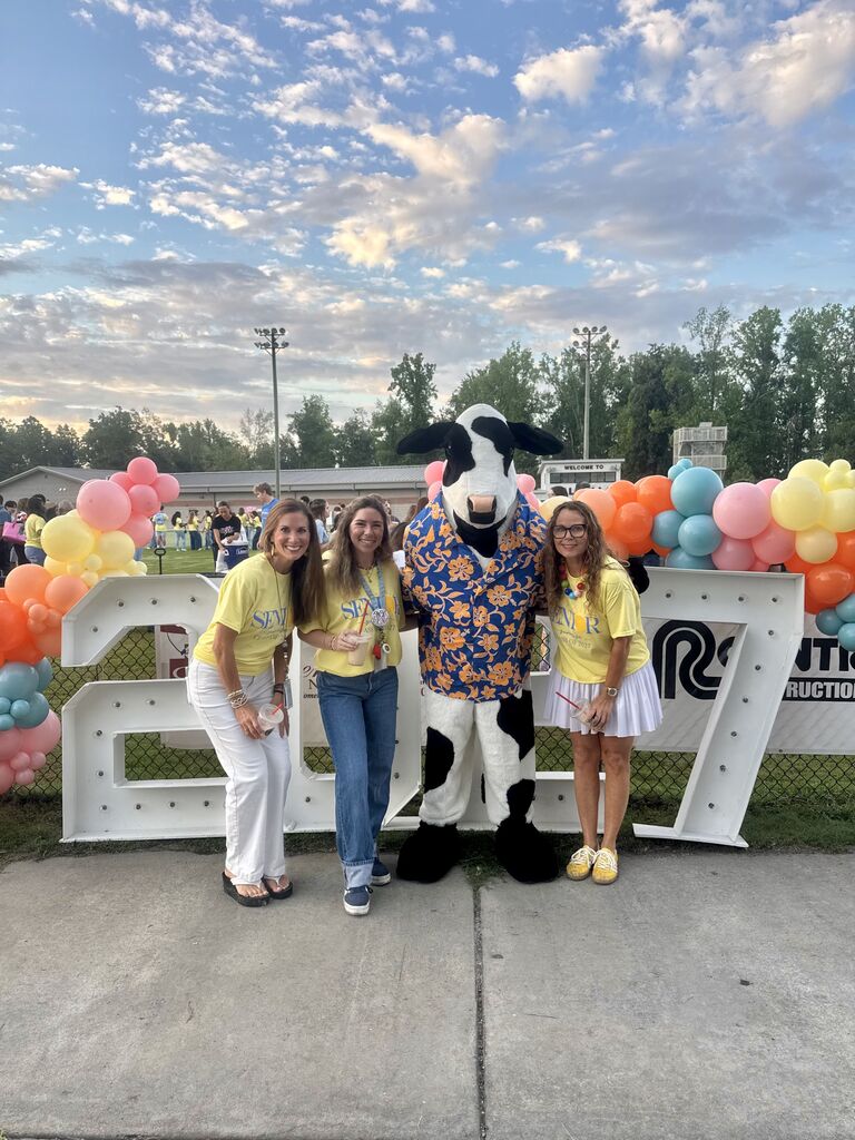 Senior Class sponsors with the Chic-fil-A cow
