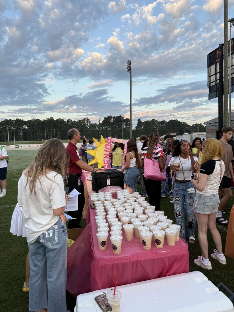 Students getting free coffees from Hug in a Mug