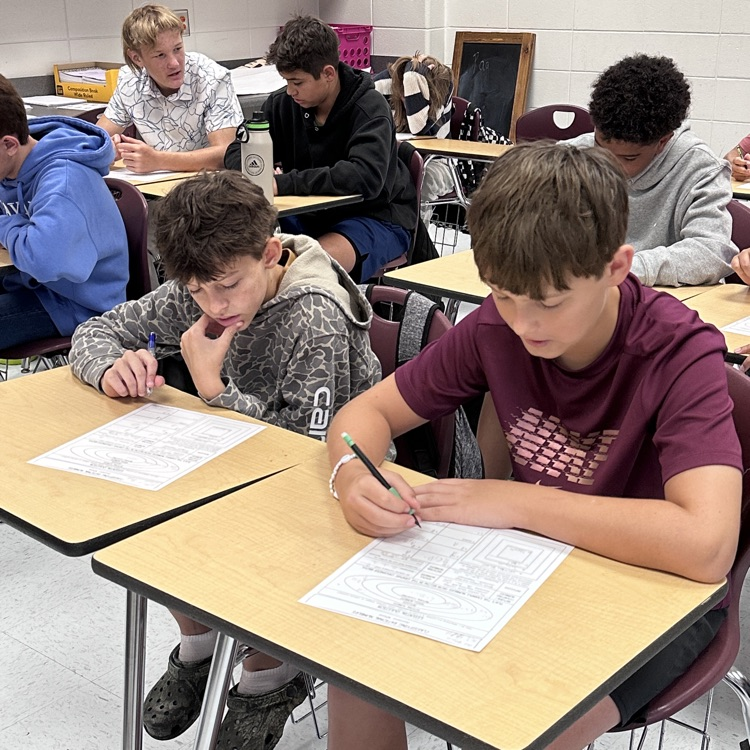 students taking math notes 