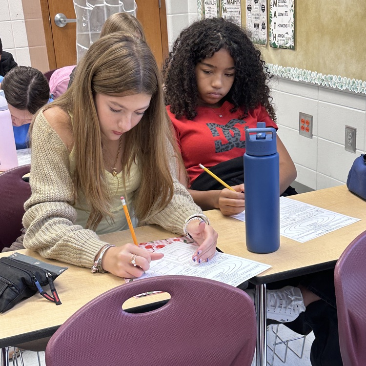 students taking math notes 