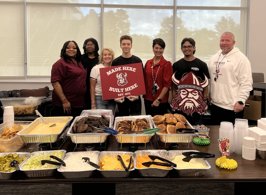 Outback employees with Principal, Asst Principal and Coach