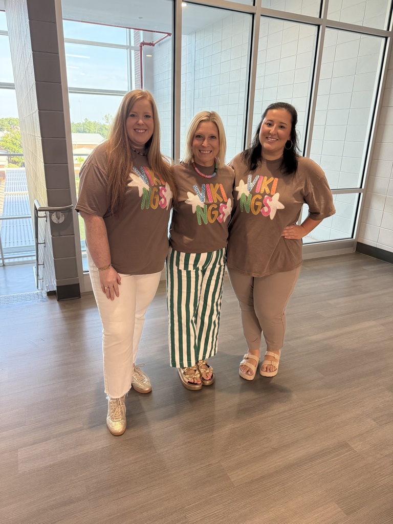 Teachers wearing the new t-shirt that is available for purchase