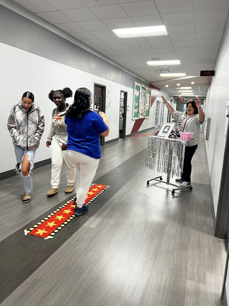 Student walking the red carpet for a prize