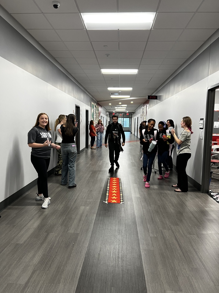 Student walking the red carpet for a prize