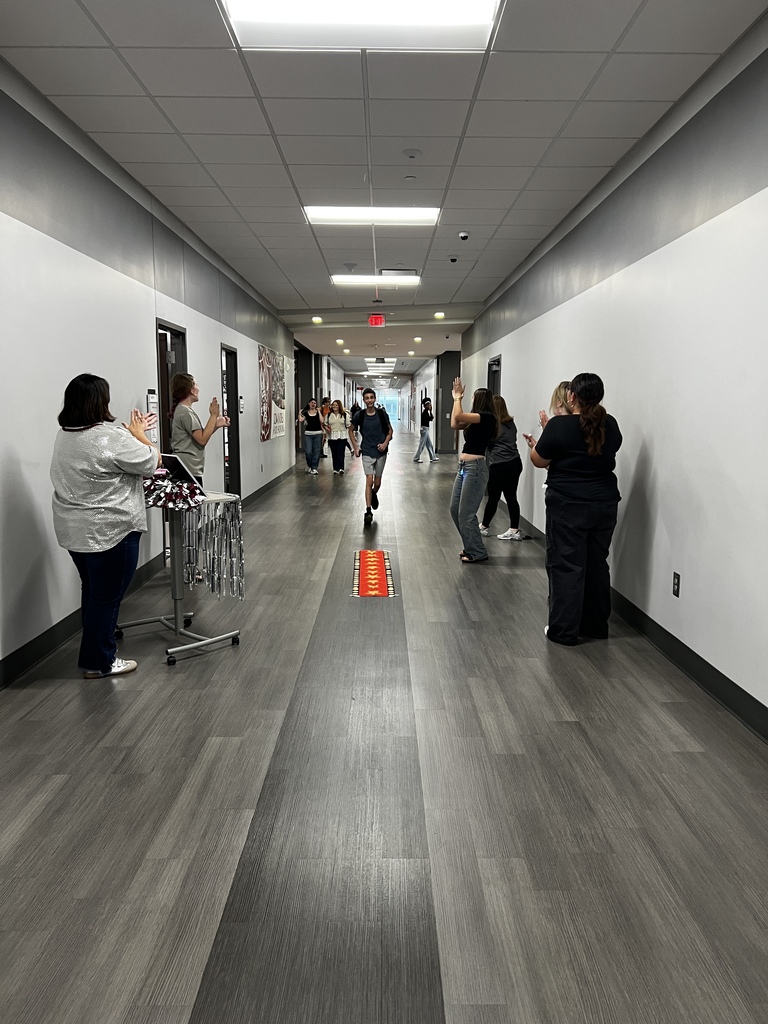 Student walking the red carpet for a prize