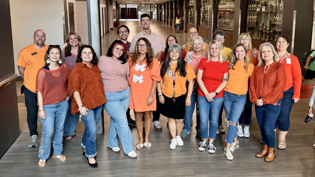 ELA department teachers dressed in orange