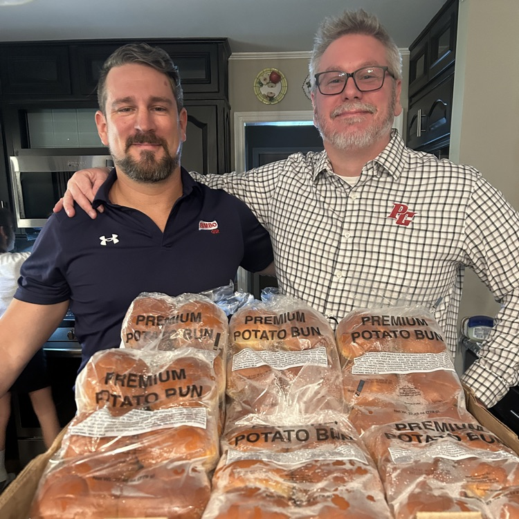 Mr. Daniels and friends from Bimbo Bakery posing with donated buns 