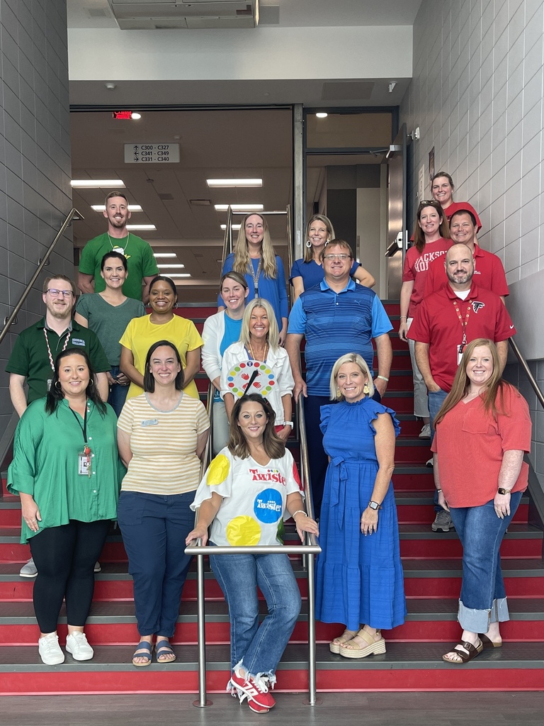 Teachers dressed in red, green, blue or yellow