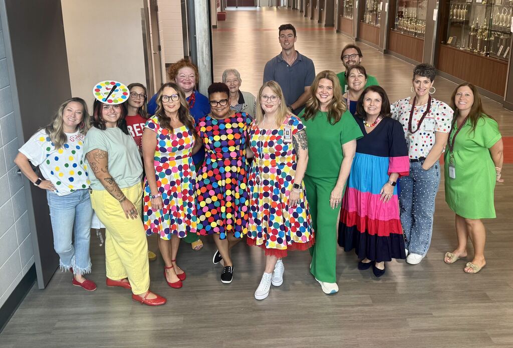 ELA teachers dressed in twister colors or dot