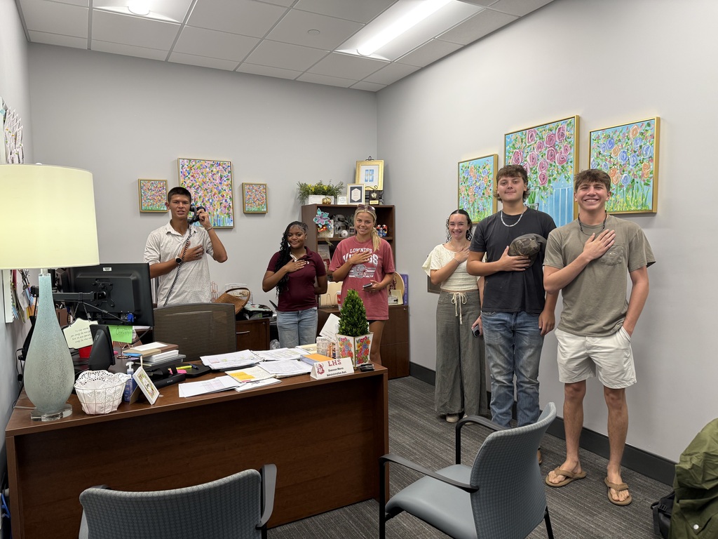 Students leading the Pledge of Allegiance over the intercom