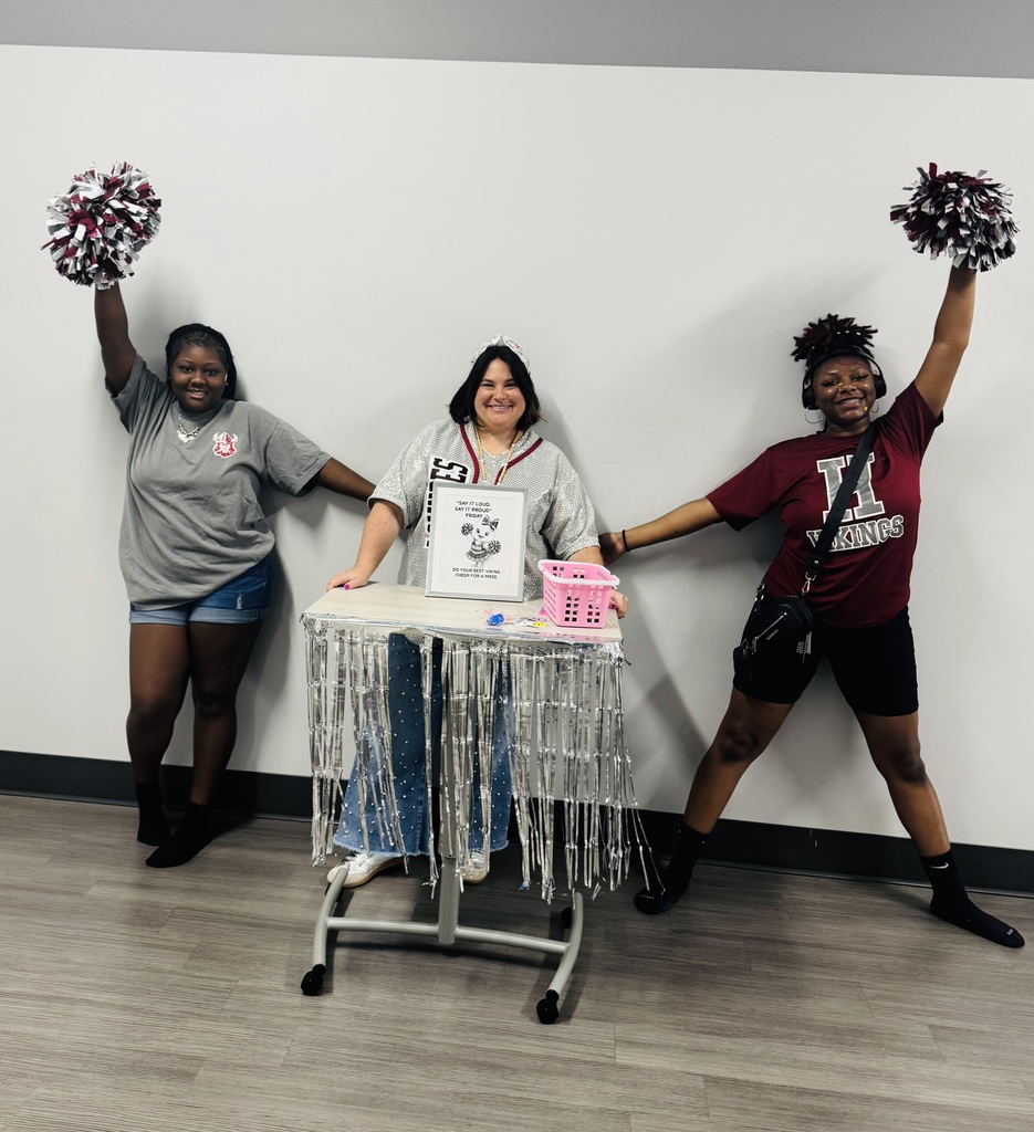 Students doing a Viking cheer for a prize