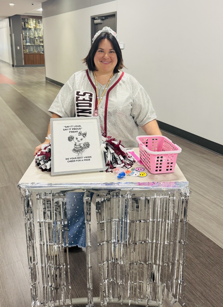 Mrs. New giving prizes for cheers