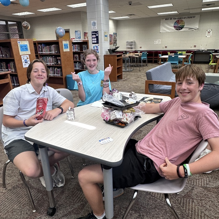 students eating in library 