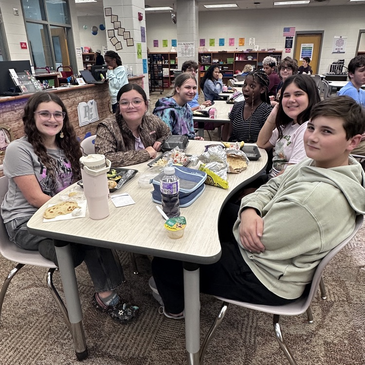 students eating in library 