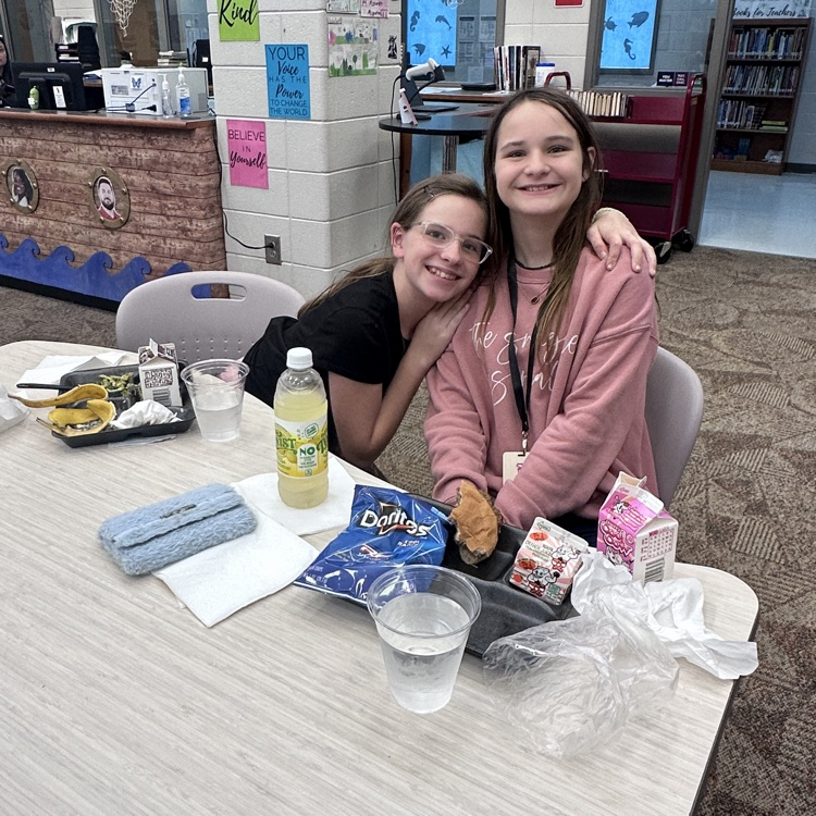 students eating in library 
