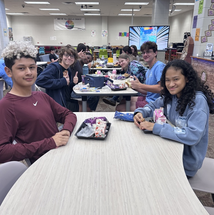 students eating in library 