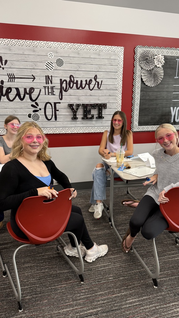 Students in rose colored heart glasses