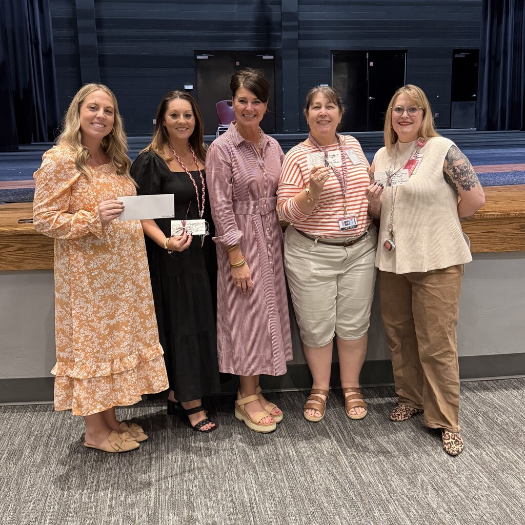 AP Hughes with recipients of gift cards from drawing at the faculty meeting.