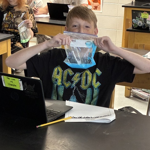student completing oobleck lab