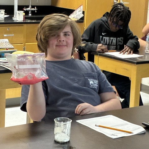 student completing oobleck lab