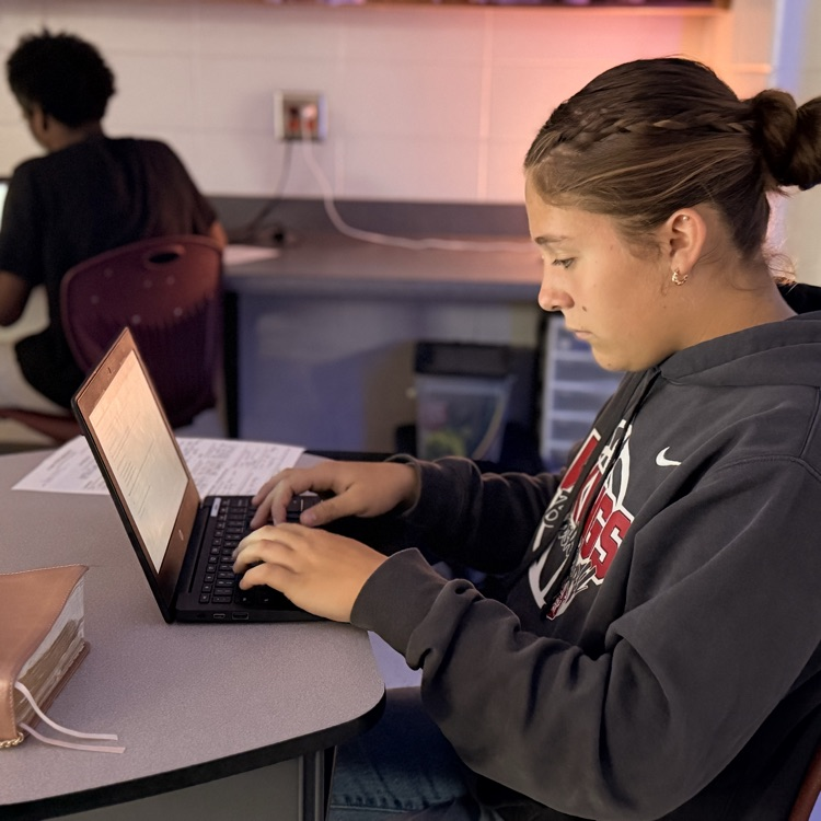 students typing narratives