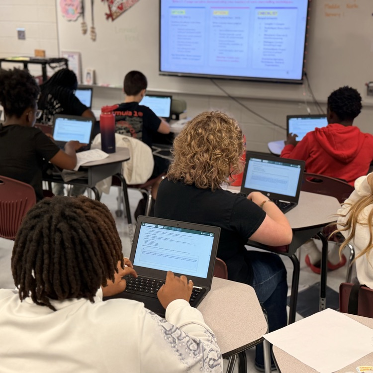 students typing narratives
