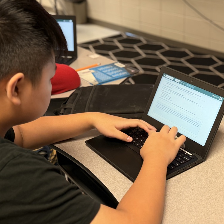 students typing narratives