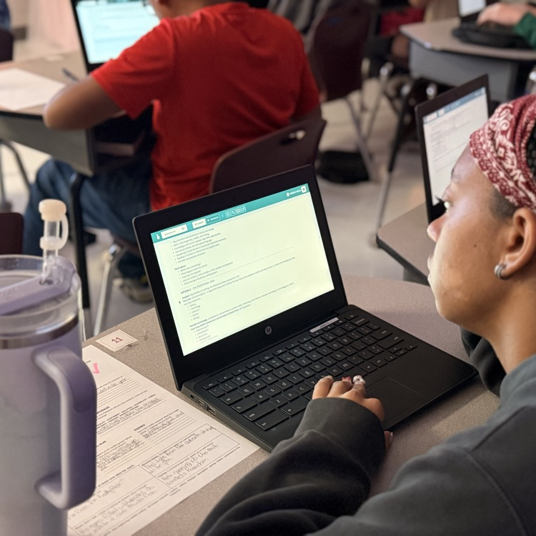 students typing narratives