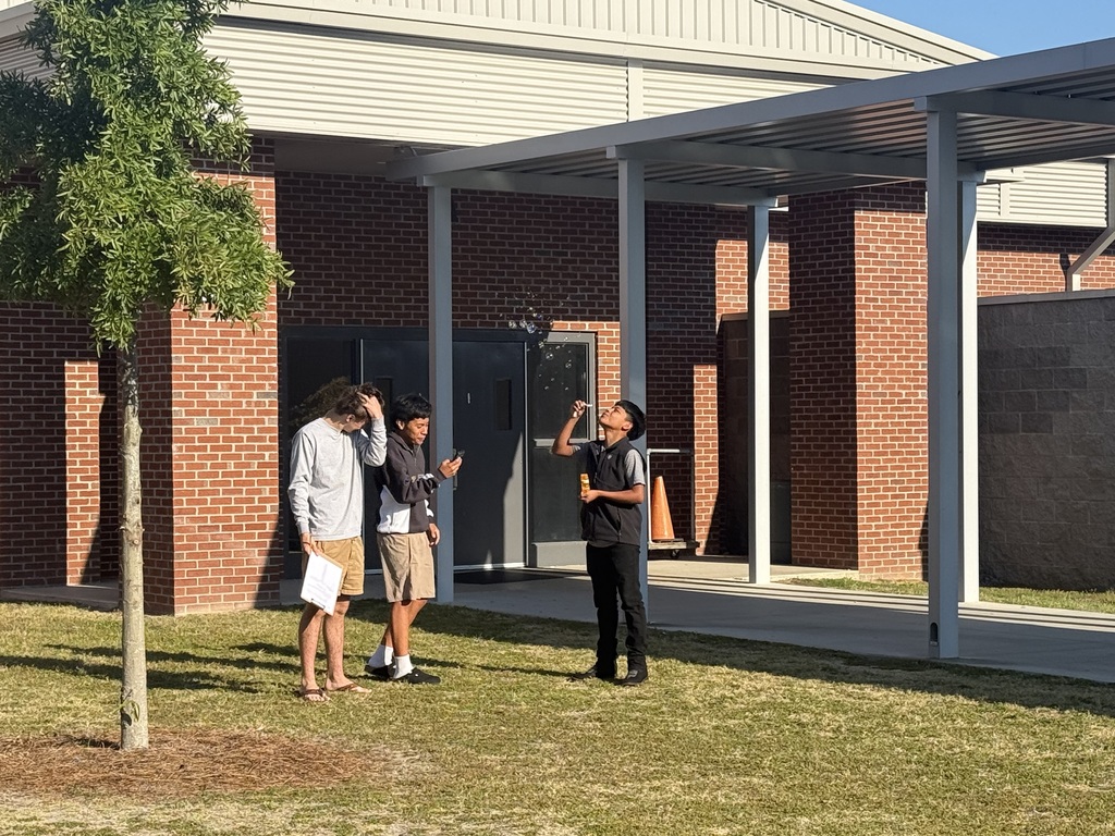 Student blowing bubbles
