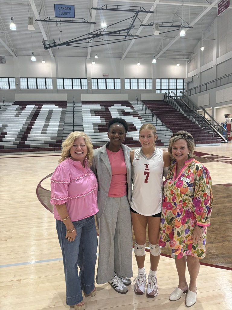 Kalli with her mentors on the Volleyball court